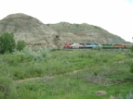 BNSF 8283 SD75I alongside Eastern Montana's finest gumbo hills